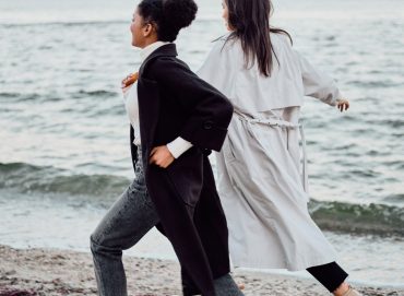 two-attractive-stylish-girls-in-trench-coats-happi-S8SUAFT.jpg